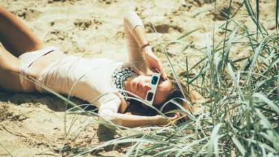 headphonik – woman lying near green grass – Photo by pawel szvmanski
